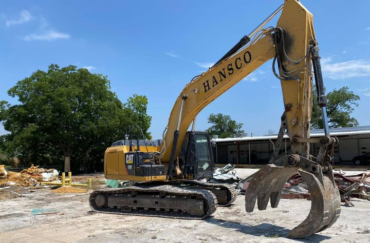Hansco, Inc. excavator on a demolition job site